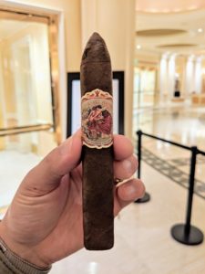 Epic La Rubia Robusto | Timothy Allen Flor de Las Antillas Belicoso cigar being held by a smoker.